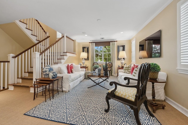 carpeted living room with crown molding