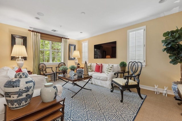 living room with visible vents, baseboards, and ornamental molding