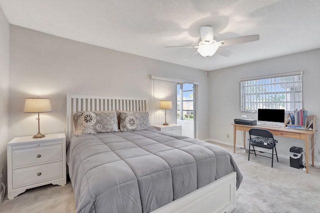 bedroom with light carpet and ceiling fan