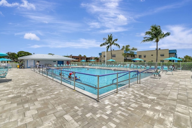 view of swimming pool with a patio