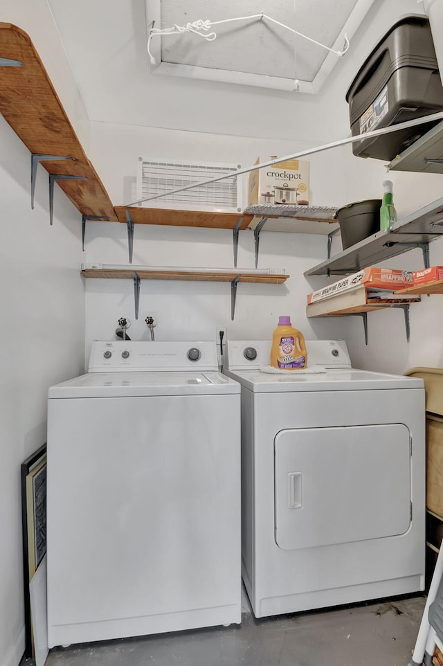 laundry room with independent washer and dryer