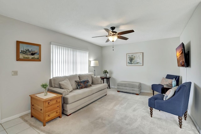 tiled living room featuring ceiling fan