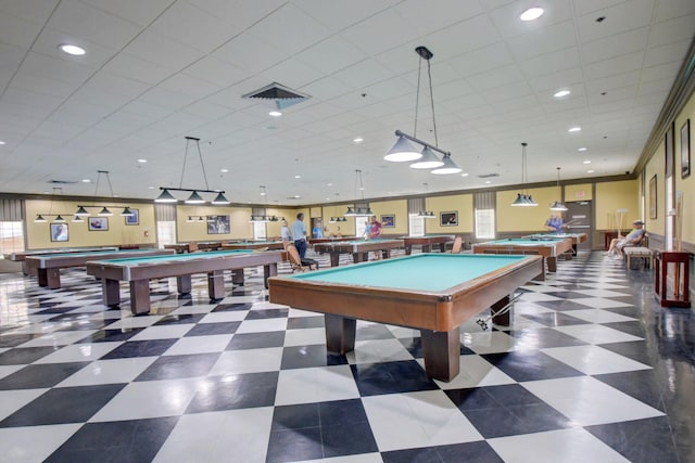 playroom featuring ornamental molding, a healthy amount of sunlight, dark tile patterned flooring, and billiards