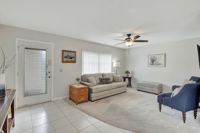 tiled living room featuring ceiling fan