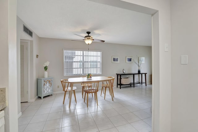 dining area featuring ceiling fan and light tile patterned floors