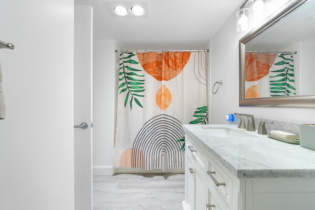 bathroom with wood-type flooring and vanity