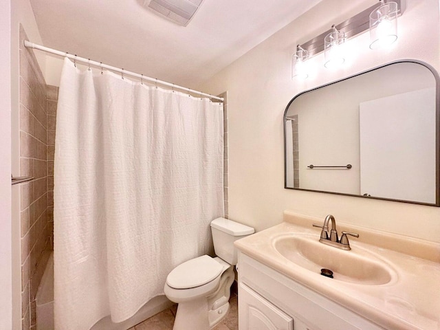 bathroom with toilet, vanity, and a shower with curtain