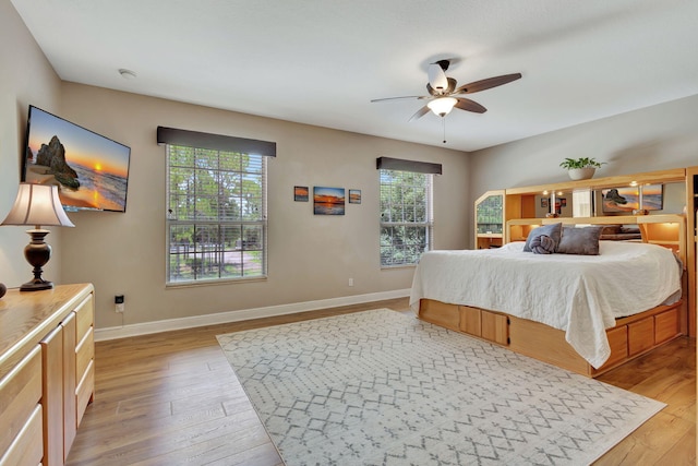 bedroom featuring ceiling fan and light hardwood / wood-style flooring