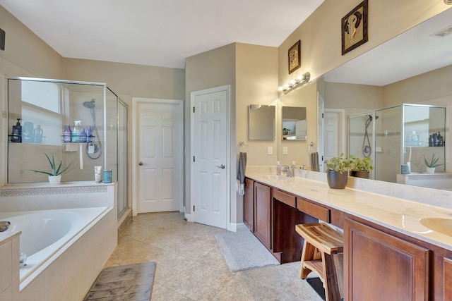 bathroom with separate shower and tub, vanity, and tile patterned flooring