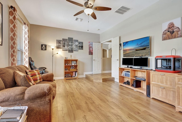 living room featuring ceiling fan and light hardwood / wood-style floors