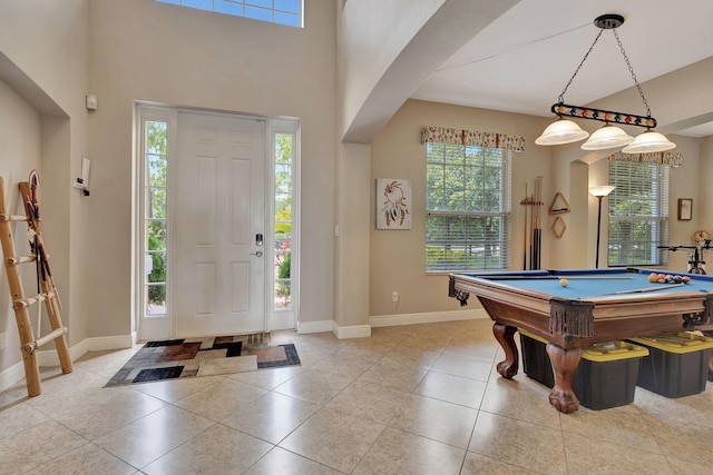 entrance foyer featuring light tile patterned flooring and billiards