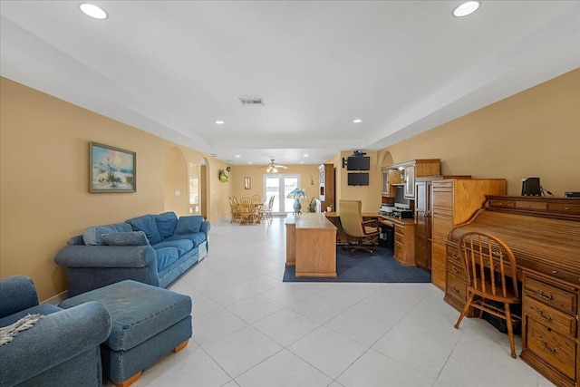 home office with ceiling fan and light tile patterned floors