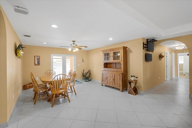 tiled dining space featuring ceiling fan