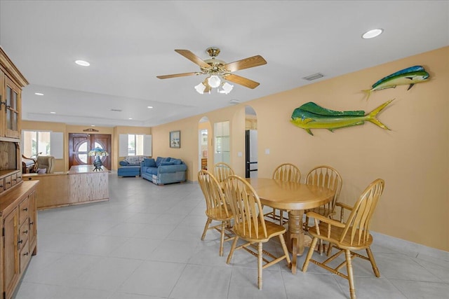 dining area with light tile patterned floors and ceiling fan