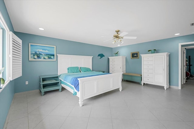 tiled bedroom featuring ceiling fan