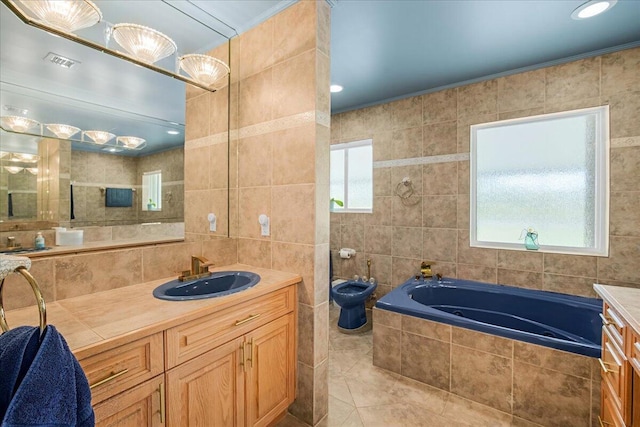 bathroom with plenty of natural light, tile patterned flooring, tile walls, and tiled tub