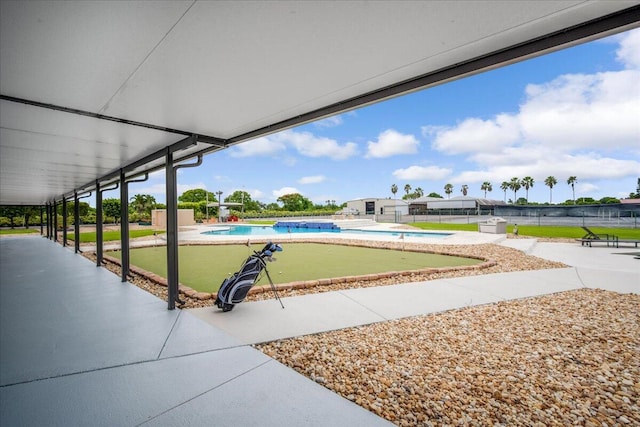 exterior space with a patio and a pool