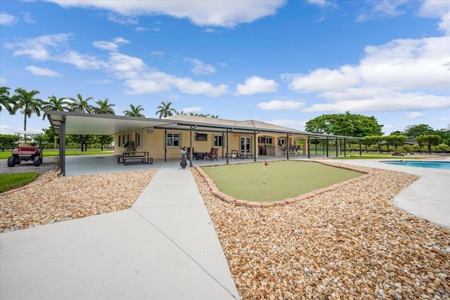 exterior space with a patio area and a fenced in pool