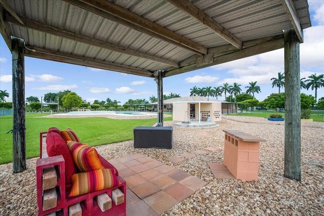 view of patio / terrace featuring an outbuilding