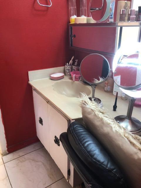 bathroom with vanity and tile patterned flooring