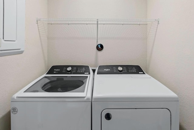 washroom featuring independent washer and dryer