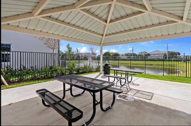 view of patio with a gazebo and a water view