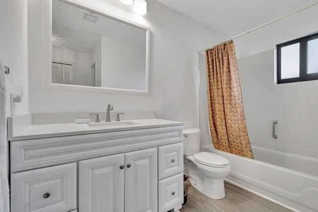 full bathroom featuring toilet, vanity, shower / bathtub combination with curtain, and hardwood / wood-style floors