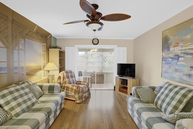 living room featuring crown molding, hardwood / wood-style floors, and ceiling fan