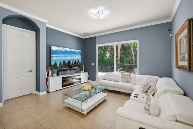 living room with light tile patterned flooring and ornamental molding