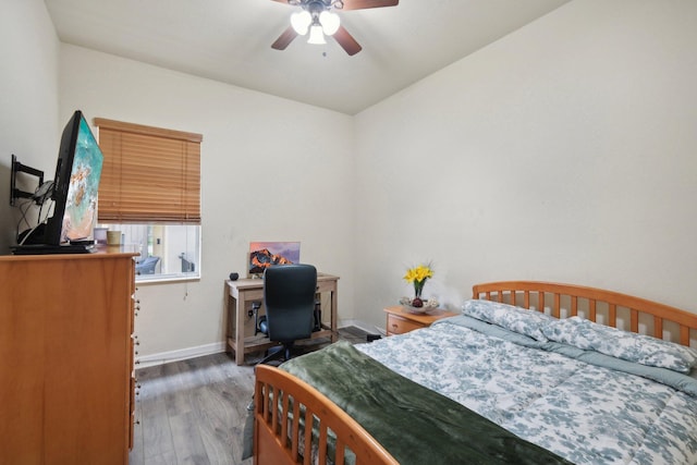 bedroom featuring ceiling fan and dark hardwood / wood-style floors