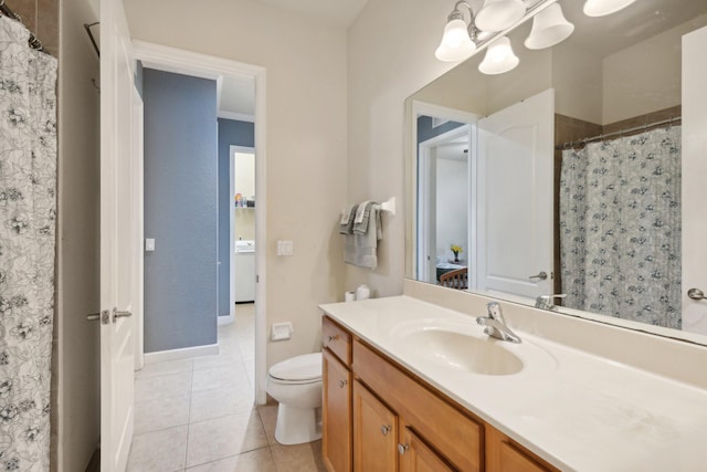 bathroom featuring a notable chandelier, tile patterned flooring, vanity, and toilet