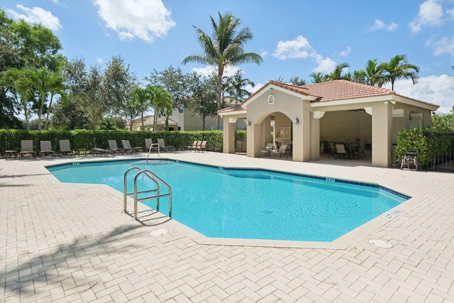 view of swimming pool featuring a patio