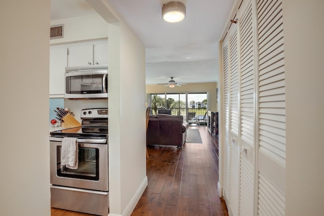 hall with hardwood / wood-style floors