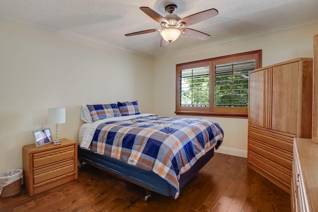 bedroom with ceiling fan, a textured ceiling, hardwood / wood-style flooring, and ornamental molding