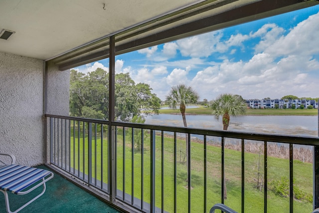 balcony featuring a water view