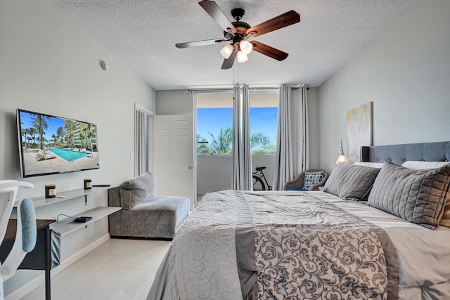 bedroom with light tile patterned flooring, access to outside, a textured ceiling, and ceiling fan