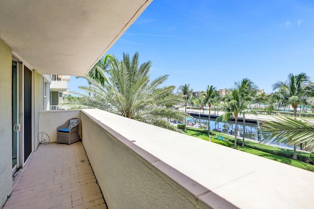 balcony featuring a water view