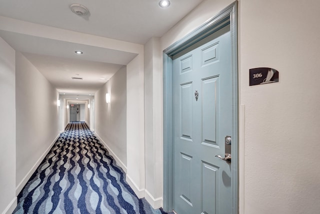 hall featuring carpet floors