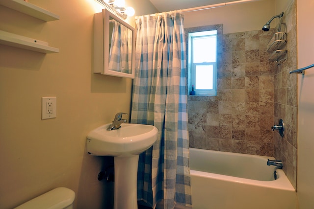 bathroom with toilet and shower / tub combo