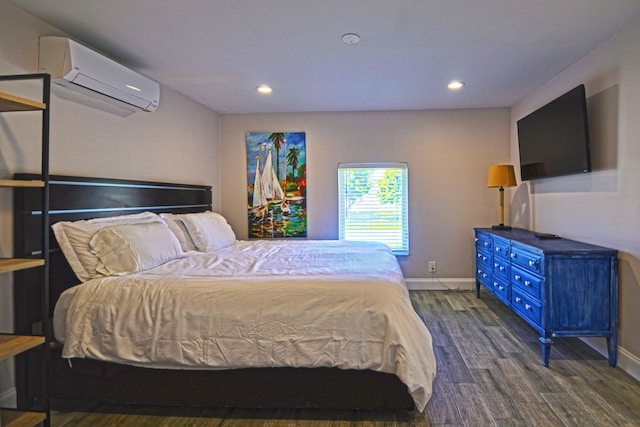 bedroom featuring a wall mounted AC and dark hardwood / wood-style flooring