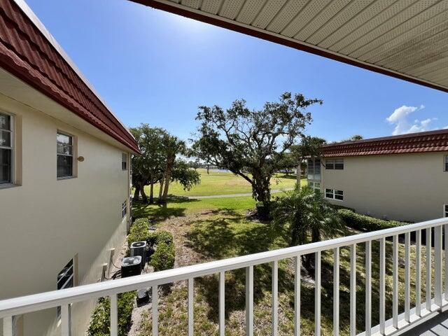 view of yard with a balcony