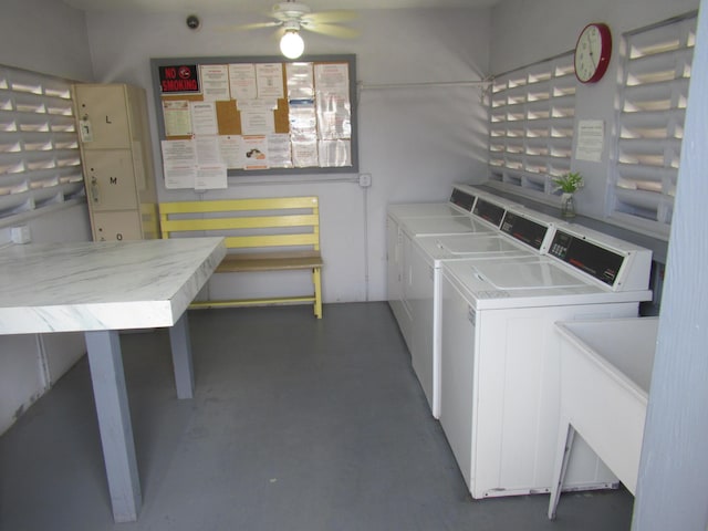 laundry room featuring separate washer and dryer, sink, and ceiling fan