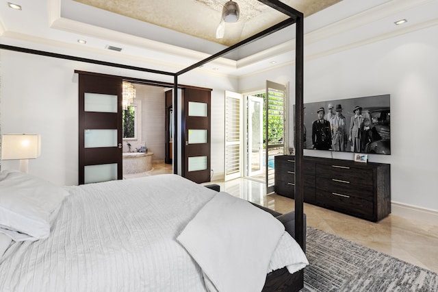 tiled bedroom featuring ensuite bathroom, access to outside, and a tray ceiling