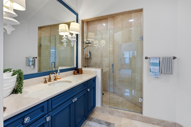 bathroom featuring vanity, tile patterned floors, crown molding, and a shower with shower door