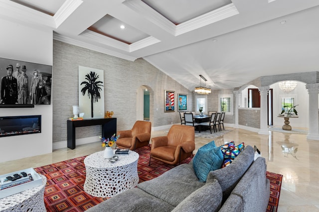 living room with light tile patterned flooring, vaulted ceiling, a chandelier, and ornate columns