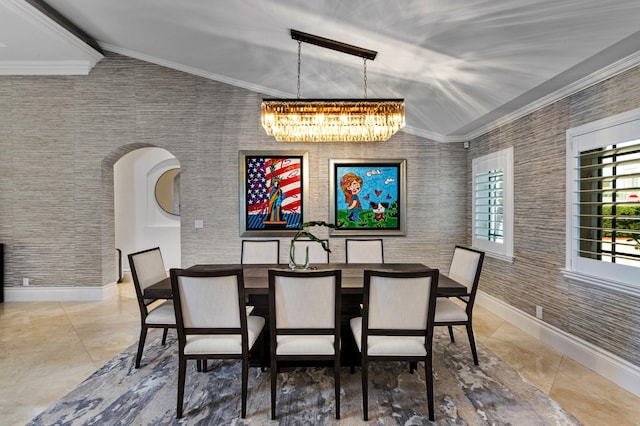 tiled dining room with a chandelier and crown molding