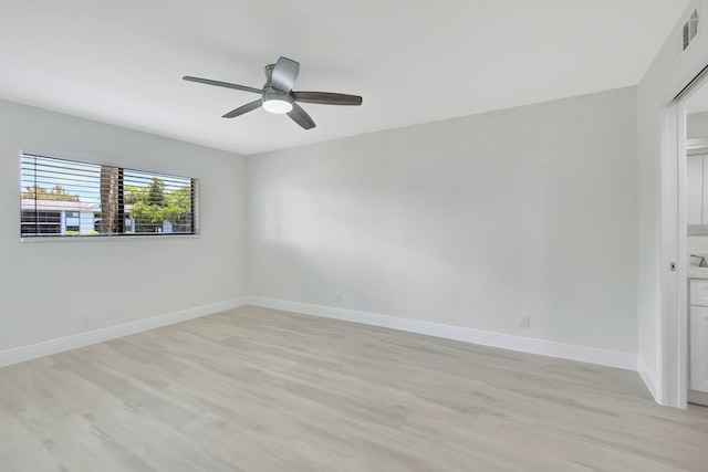 unfurnished room with ceiling fan and light hardwood / wood-style flooring