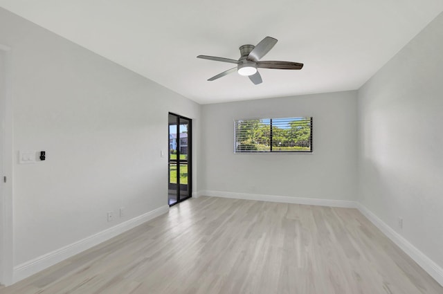 spare room featuring light wood-type flooring and ceiling fan