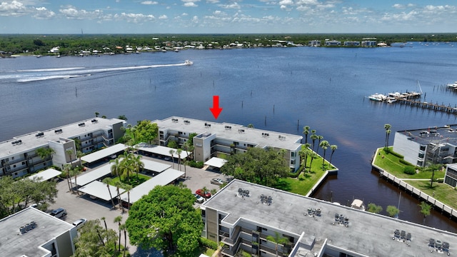 birds eye view of property featuring a water view