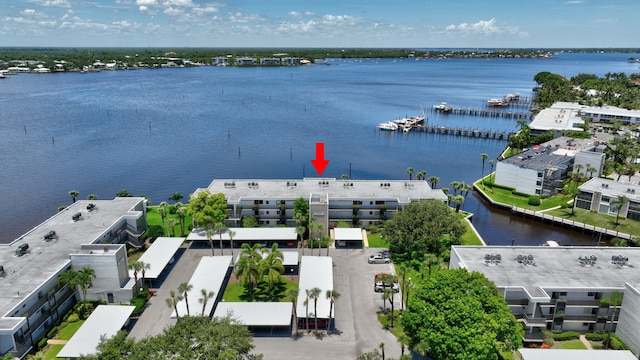 birds eye view of property featuring a water view